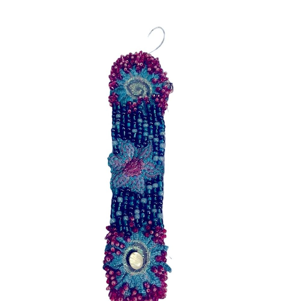 Hand-crafted bead embroidered cuff bracelet.